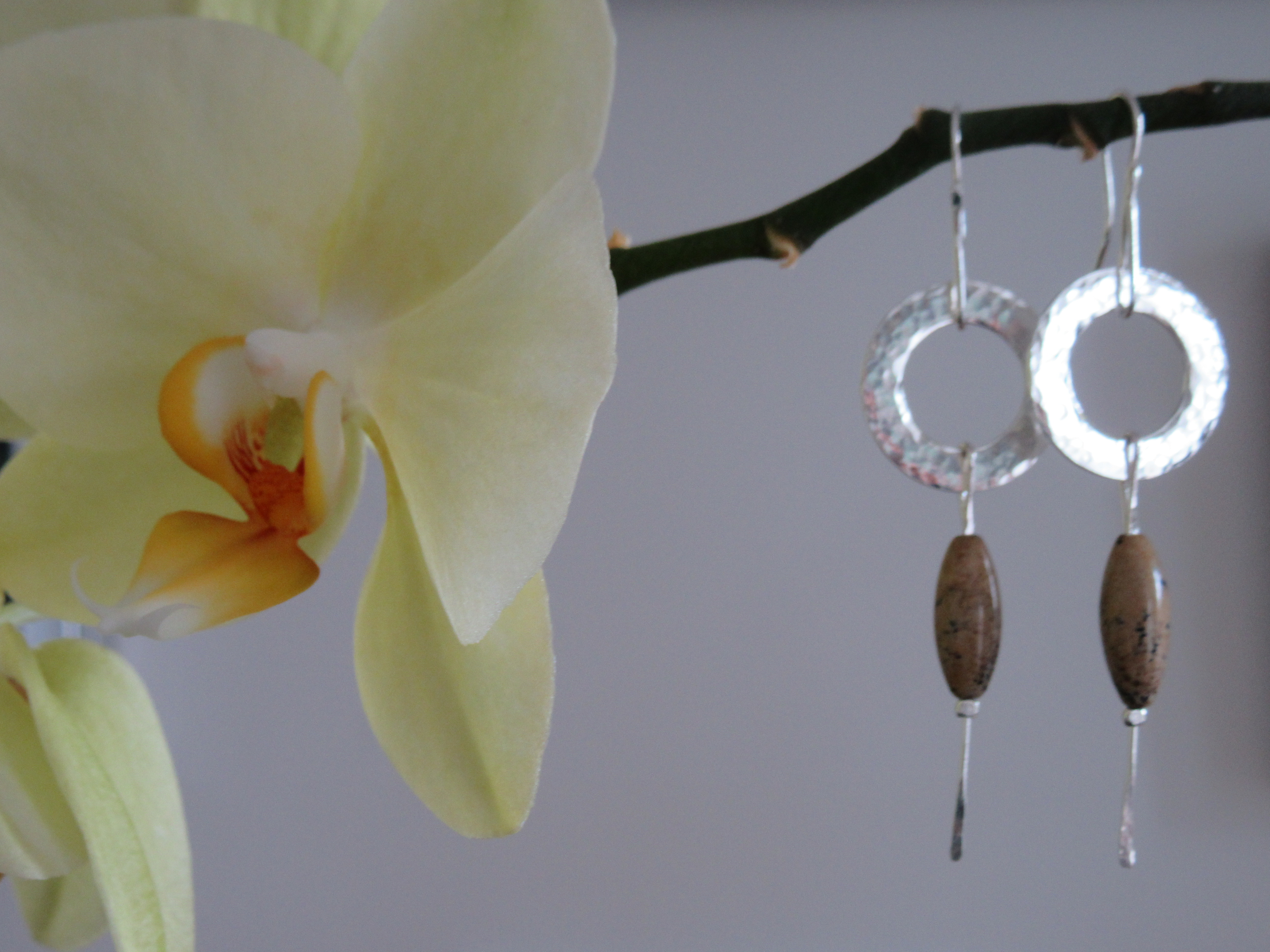 Hammered silver wheel earrings with natural jasper oval drop
