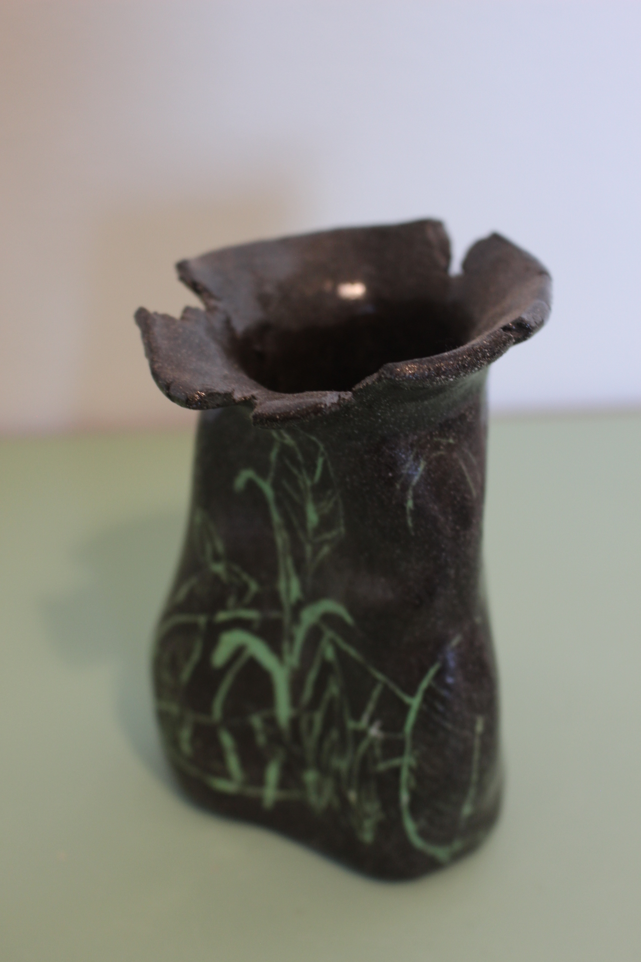 Choc brown clay vase with a green leaf detail
