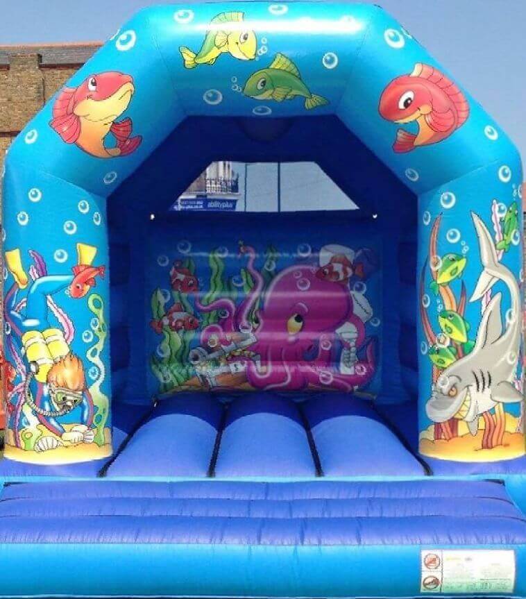 blue bouncy castle with pictures of fish diver sharks