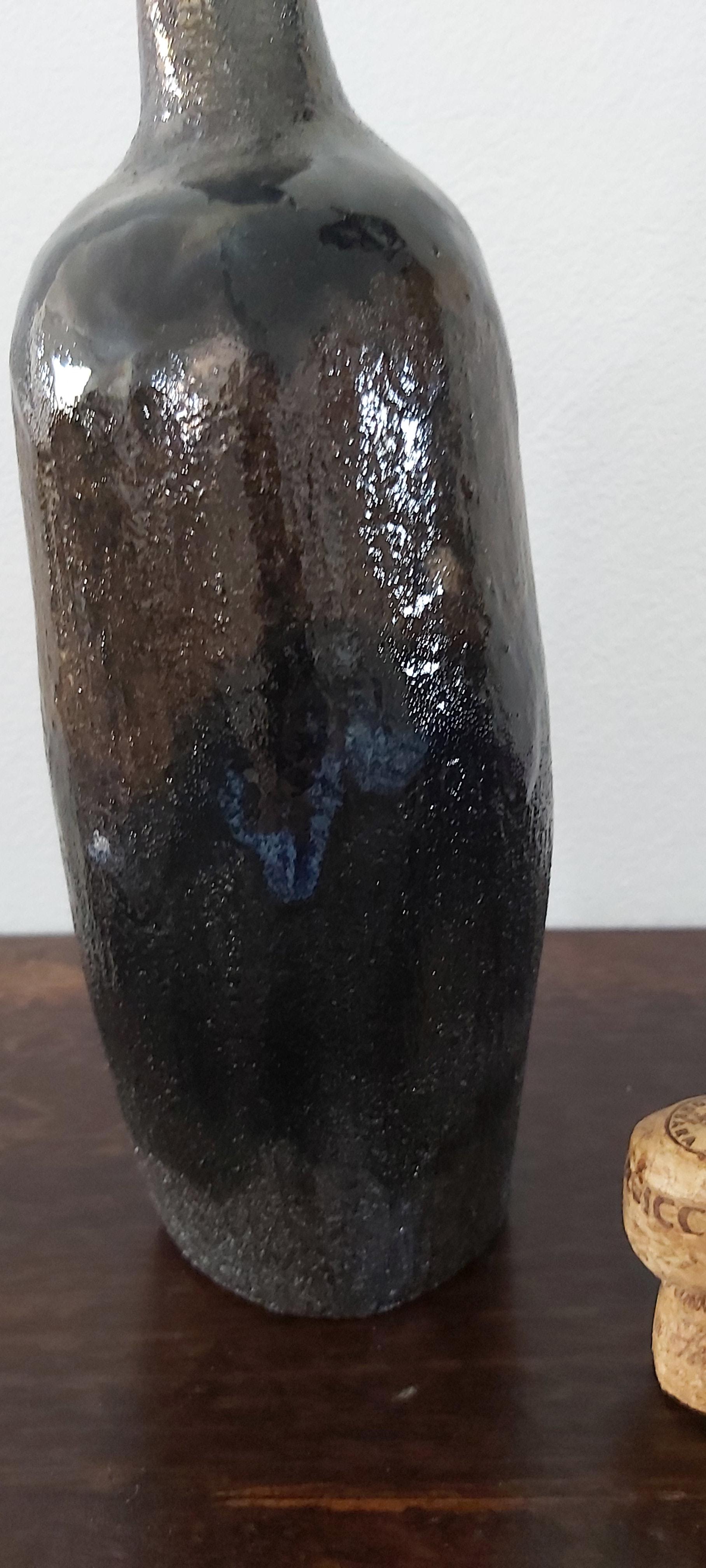 Chocolate brown clay bottle