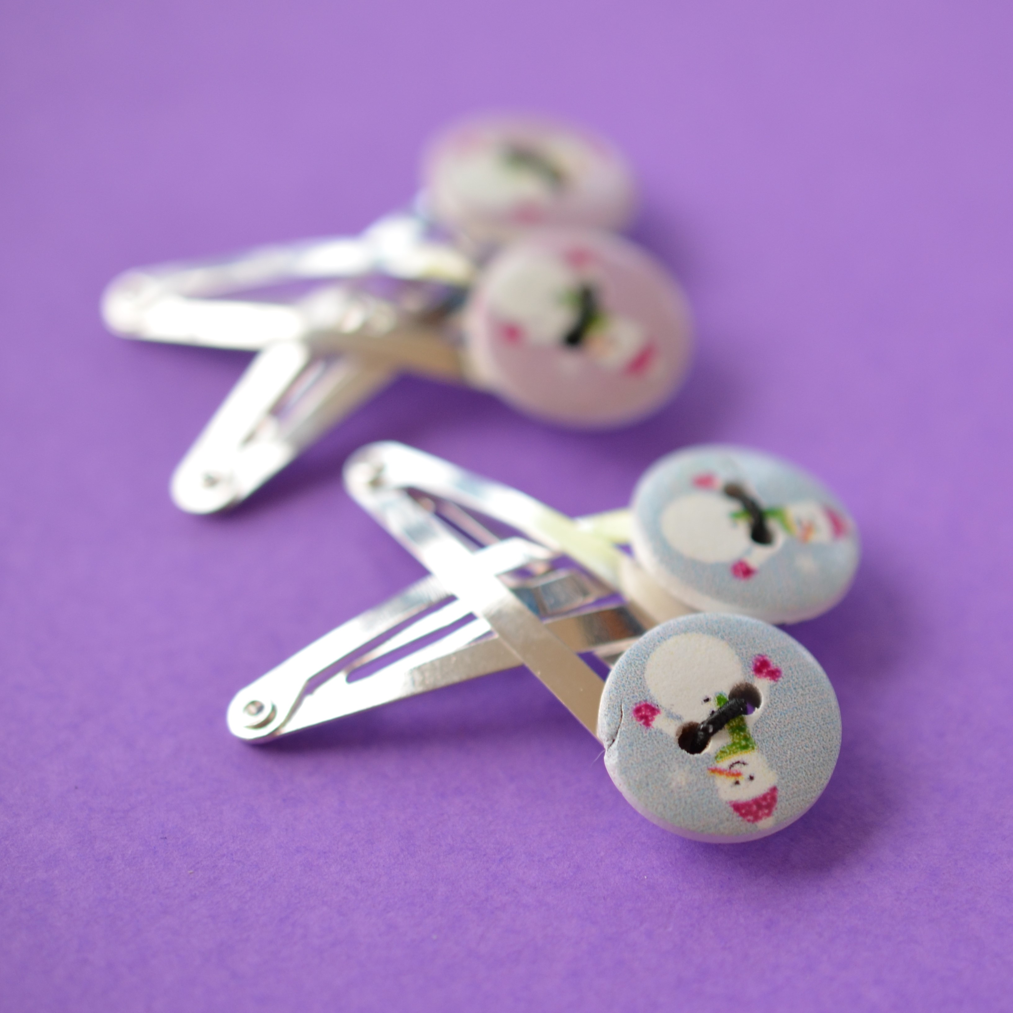 Two Pairs of Christmas Button Hair Clips with Cute Snowman Pale Blue & Pink Lavender Colours