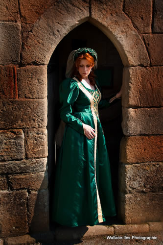 Bottle green gown with gold vertical detail and leg of mutton sleeve