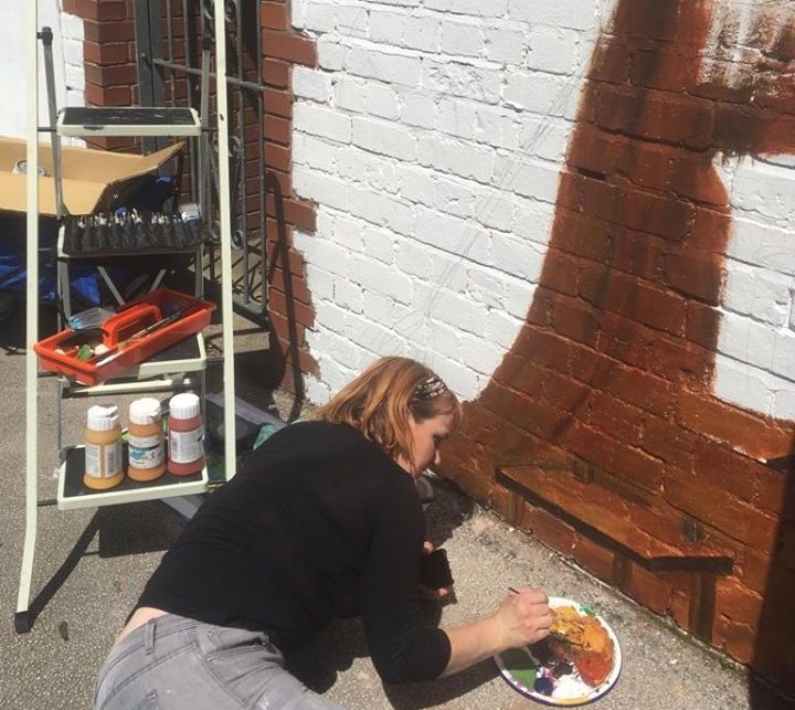 Rachel Akers of Akers of Art Painting the mural at Harborne Primary School