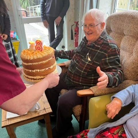 Resident well pleased with his cake from our chef  6323jpeg