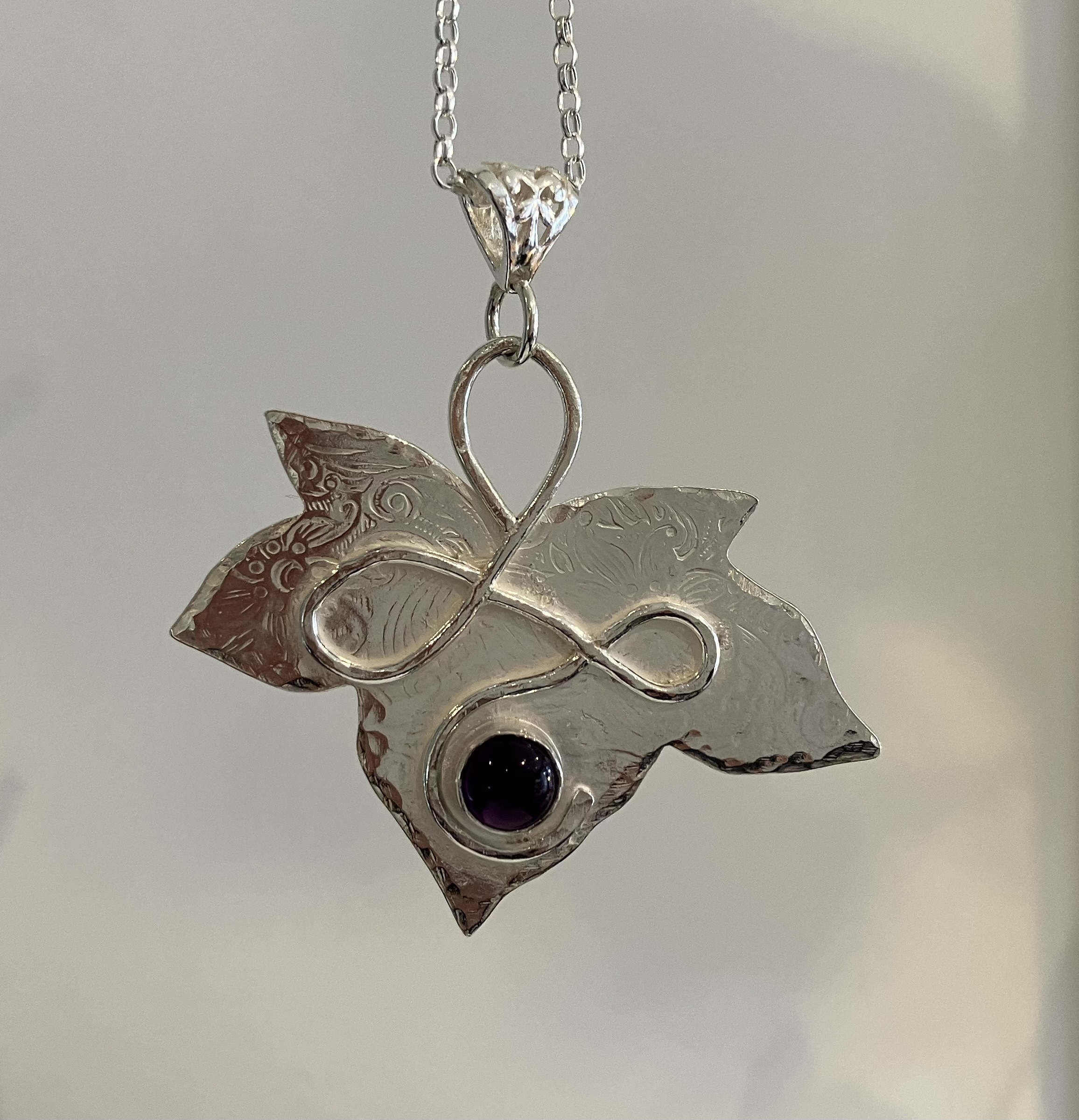 Silver leaf amethyst pendant with filigree bale