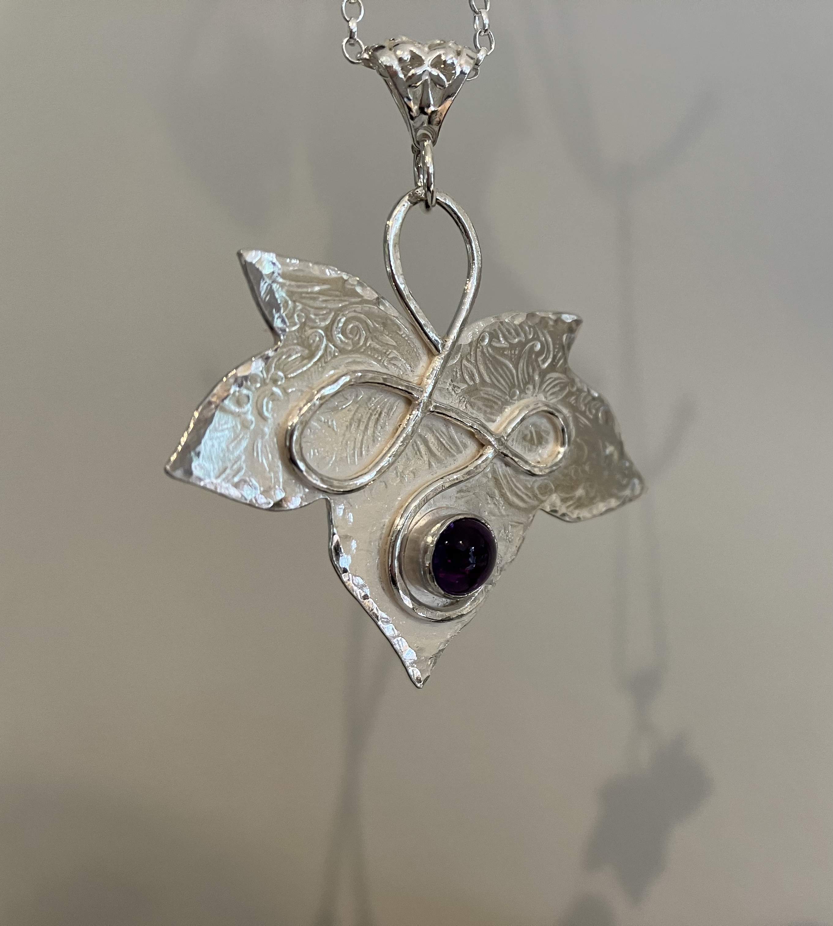 Silver leaf amethyst pendant with filigree bale