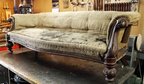 A settee in shoddy condition before restoration work by Steve Grimshaw
