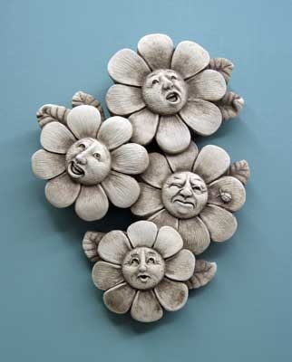 Four flowers with funny faces