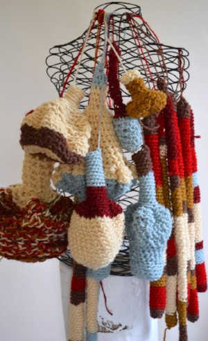Ongoing work, free crochet forms hanging on a wire bust.